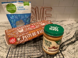 jar of peanut butter, bag of sugar, and eggs