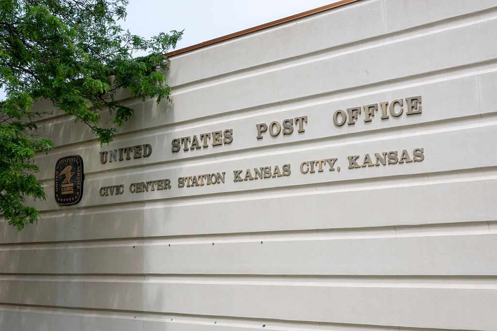 Logo of the Post office on the side of the building in Kansas